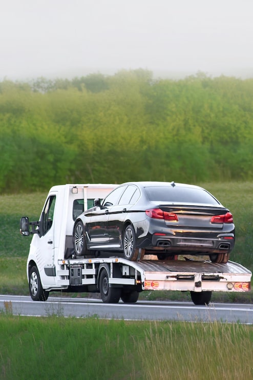 emergency-recovery-vehicle-towing-car-after-breakdown_782515-30034